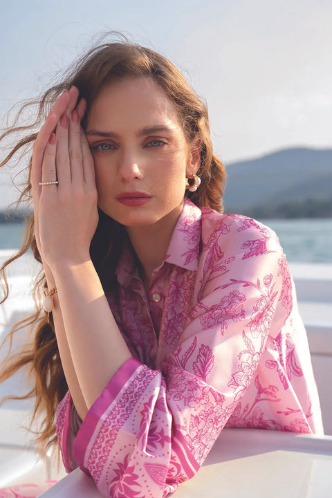 Close-up portrait of pink printed silk shirt with soft feminine print